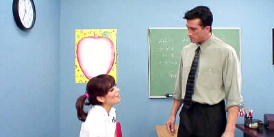 A pretty woman is getting penetrated on top of the school desk