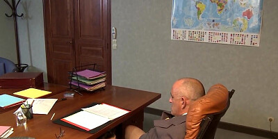 Brunette secretary gives a blowjob under the desk