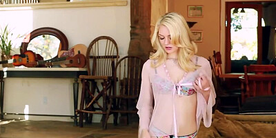 Young blonde with natural tits masturbates in the living room