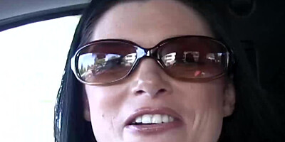 Hot raven-haired milf in sunglasses gives head in the car