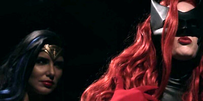 Masked redhead turns conflict with Wonder Woman into lesbian sex