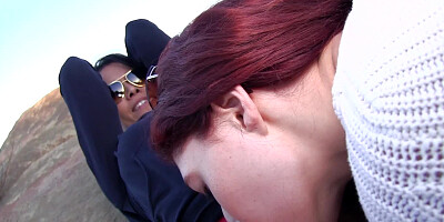 A redhead is getting licked and fucked on the rocks here