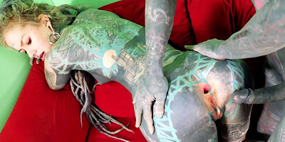 Totally tattooed freak with long dreadlocks fucks his girlfriend