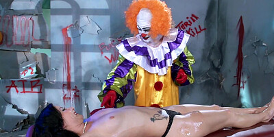 A cute thing is getting fucked by a clown on the massage table