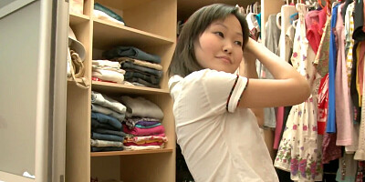 Petite Asian chick is being filmed while undressing
