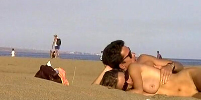 Voyeur camera catches nude lovers on the beach