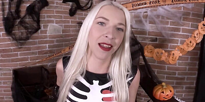 Blonde girl in skeleton costume fingers pussy after reveals tits