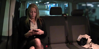 Taxi driver takes care of bored blonde girl in the backseat
