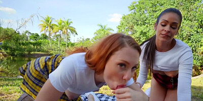 Depraved schoolgirls are having a threesome in the sunny day