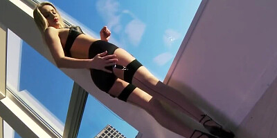 Astonishing blonde with red lips masturbates on the windowsill