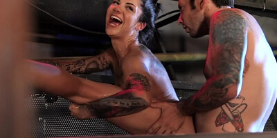 Inked whore squirts during kinky anal sex with stud in basement