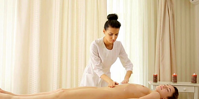 Lesbian masseuse is playing with the clit of a client