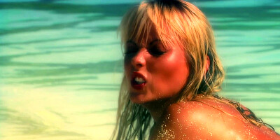 Lesbian sex action on the beach on a beautiful summer day