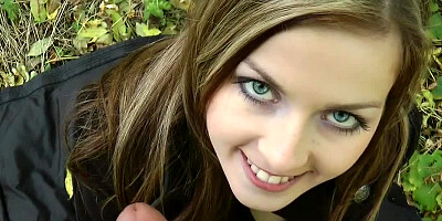 Blue eyed hottie is on her knees, sucking some dick outdoor
