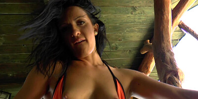 A raven haired girl is getting her pussy teased and caressed