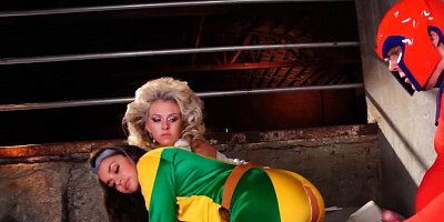 Two babes and one masked fellow fucking at cosplay sex party