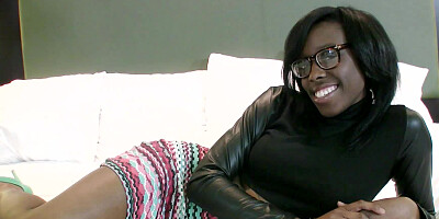 A black chick with a sexy ass and large tits is on the bed, naked
