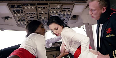 The lucky pilot is in a cockpit with two tremendous stewardesses