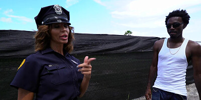 Two lady cops are having a threesome with a large black dude