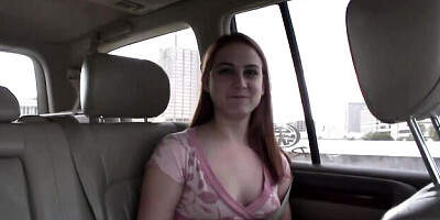 Redhead cutie shows off her shaved pussy on the backseat