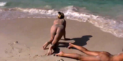Slutty lezzies flash pussies fisting them on the beach