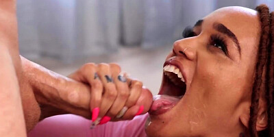 Curvy black belle with ripped jeans impaled by white stud