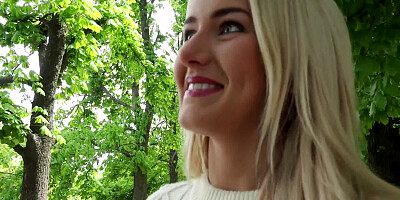 A lovely blonde is in the forest and she is giving a blow job