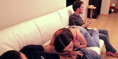 The husband was busy playing while I was giving a blowjob to his friend