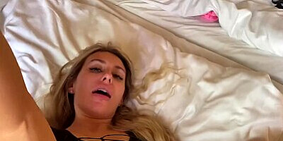 A depraved bitch in a black dress stretches her pussy for a big dick