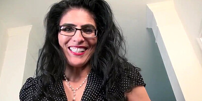 American milf Lilly James does a slow striptease and plays