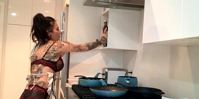 Inked minx is stuffing her itching pussy with a big black dildo