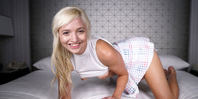 Short-haired blonde chick plays with a big pink dildo