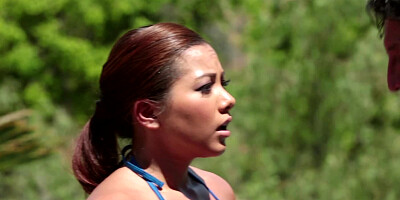 A redhead with a hot face is getting cum all over her pretty ass
