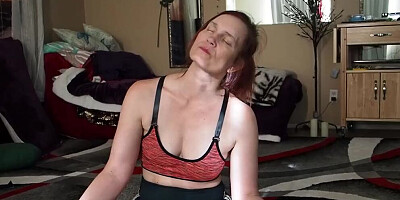 Naughty MILF is stretching while doing Yoga on the floor