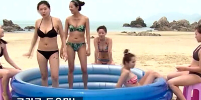 Lovely Asian chicks are getting naked at the public beach