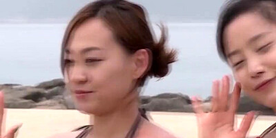 Lovely Asian chicks are getting naked at the public beach