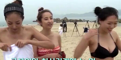 Lovely Asian chicks are getting naked at the public beach