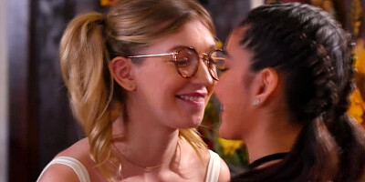 Emily Willis and Mackenzie Moss kiss passionately and sliding their clothes off