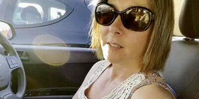 Hitchhiker MILF grabs driver's cock and blows him in the car