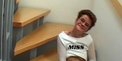 Old grandma is touching her tight pussy on the stairs