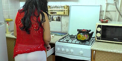 Amateur stepmom is getting fucked by her stepson's mate in the kitchen