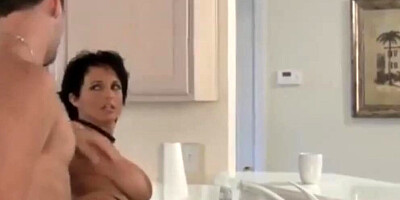 Brunette bombshell Sunshine Seiber receives a cock in the kitchen