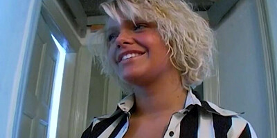 A busty blonde German babe posing her shaved pussy