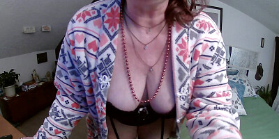 Perverted granny is playing with her muff in front of the cam