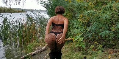 Naughty mature lady Lukerya loves to flash her ass and tits