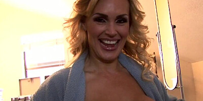 Full-bosomed blonde cougar shakes her big tits for the camera