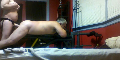 Kinky MILF fucks her slave with a big strap-on dildo