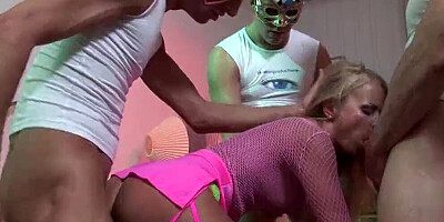 Slutty blonde girl is fucked by two masked guys in a 3some