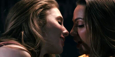 Two girlfriends are engaging in lesbian intercourse and pussy eating in a classroom