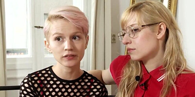 Two flashy lesbians are being interviewed and involved in a hot action
